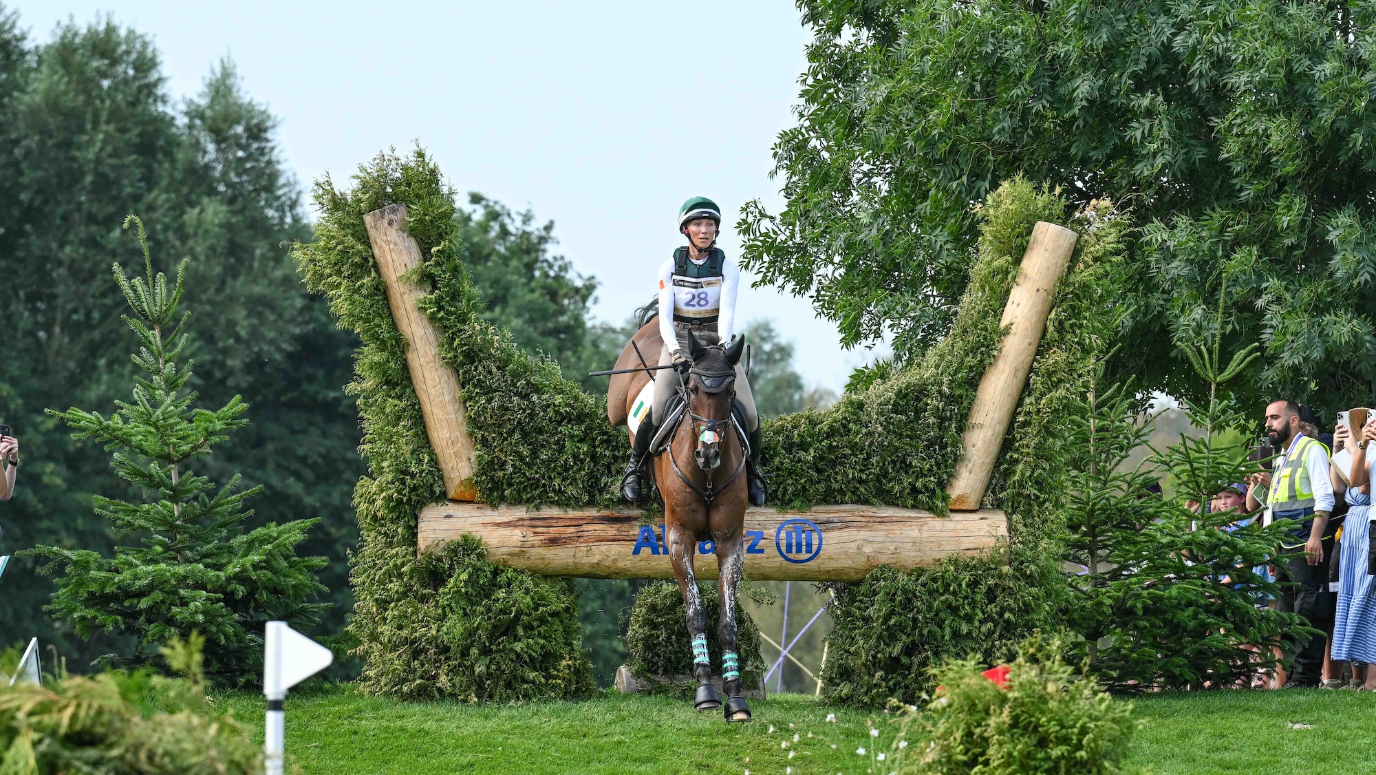 Aoife Clark jumps the brush hedge at the Allianz Water Complex on Full Monty De Lacense at the Aachen World Championships 2026
