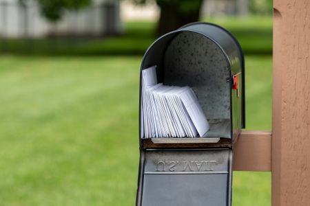 image of a open mailbox with mail inside