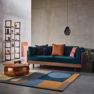 Habitat Victor 3 Seater Sofa in a modern stylish living space with a bronze coffee table, geometric rug, and a chest of drawers to the left