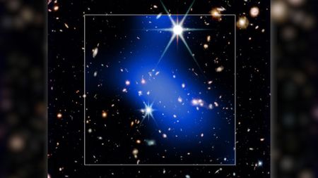 A bright blue streak of light is seen covering a series of bright stars in this dark deep space image. A white box surrounds the blue shape