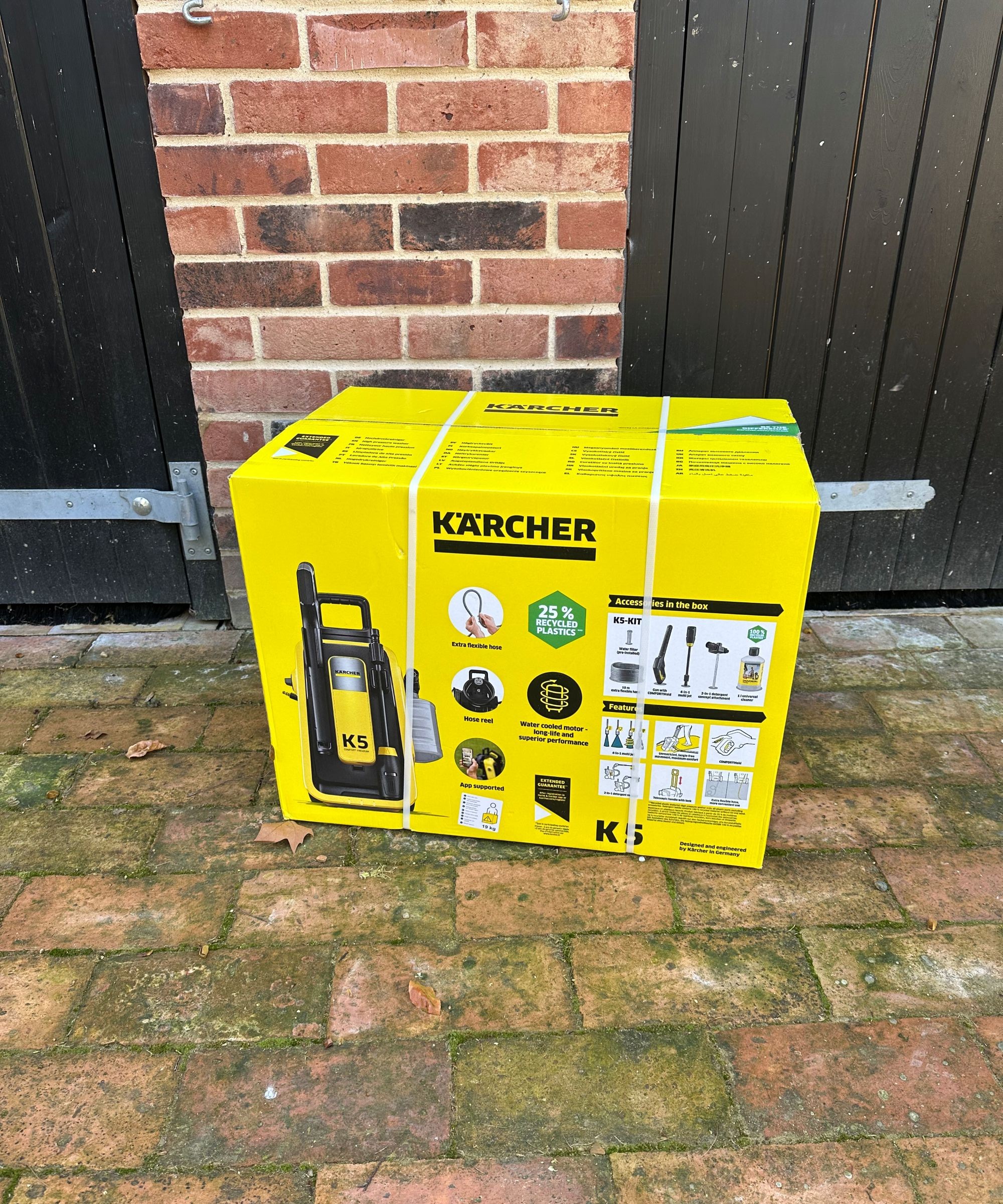 A yellow K&amp;auml;rcher K5 comfort premium pressure washer after unboxing and assembling