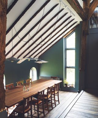 Green walls, wooden dining table