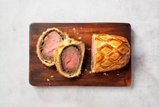 lamb wellington wrapped in puff pastry with two slices