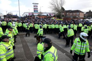 Police surround fans ahead of the match between Birmingham and Aston Villa