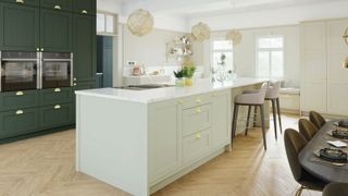 a bright light kitchen with a central island