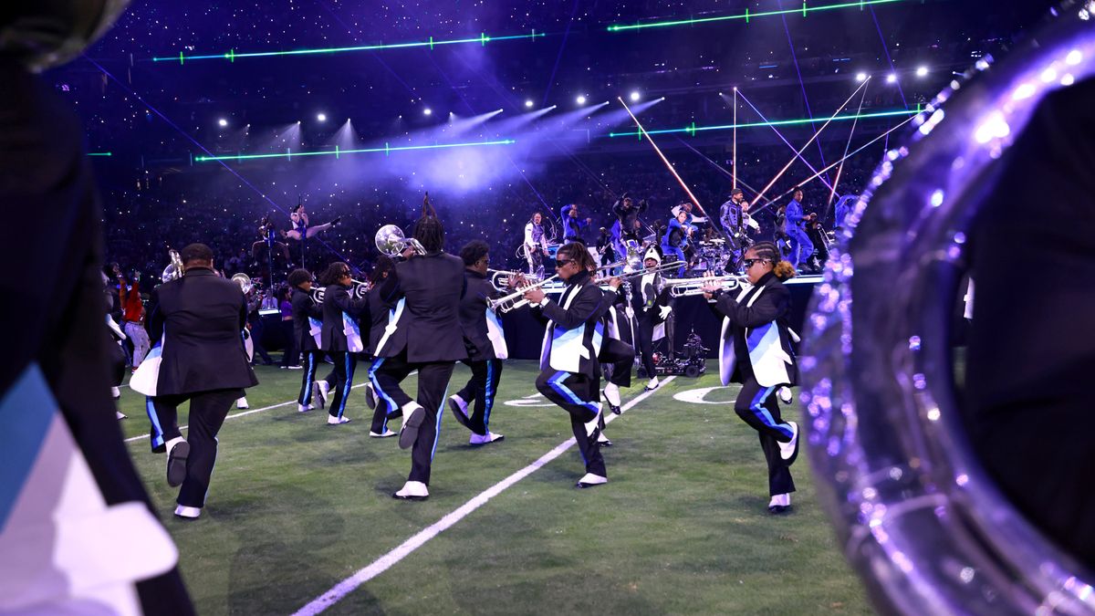 Performers play instruments on the pitch during the Super Bowl halftime show 2024