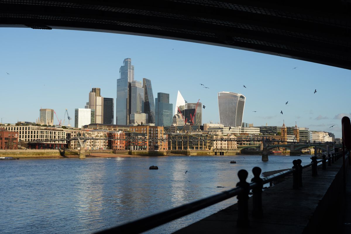 View of the city of London framed by a bridge