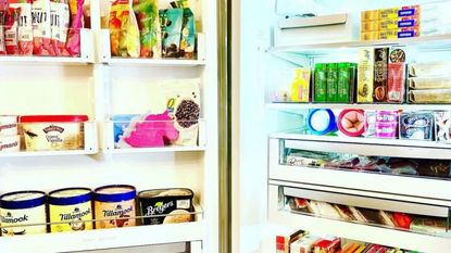 An image of neat and ordered freezer with items stacked neatly on shelves and in caddies