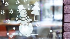 Christmas window display with chalk snowman
