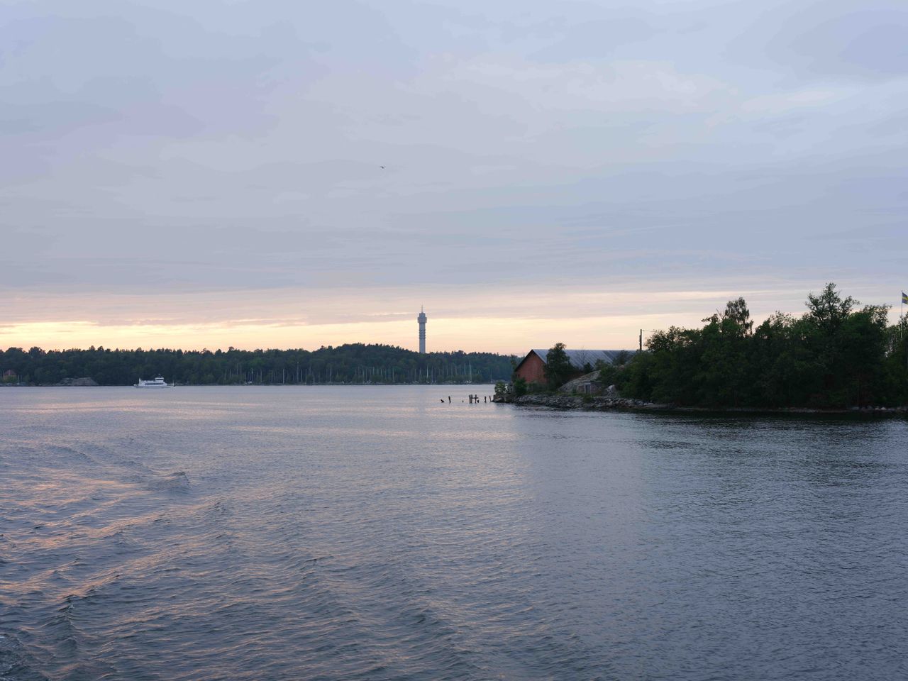 Old hut on the edge of the river near Stockholm