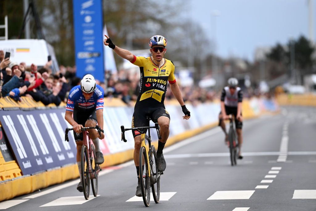 HARELBEKE BELGIUM MARCH 24 Wout Van Aert of Belgium and Team JumboVisma celebrates at finish line as race winner ahead of Mathieu Van Der Poel of The Netherlands and Team AlpecinDeceuninck and Tadej Pogaar of Slovenia and UAE Team Emirates during the 66th E3 Saxo Bank Classic Harelbeke 2023 a 2041km one day race from Harelbeke to Harelbeke on UCIWT March 24 2023 in Harelbeke Belgium Photo by Tim de WaeleGetty Images