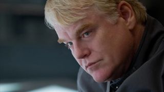 Philip Seymour Hoffman as Plutrach Heavensbee in Hunger Games Mockingjay Part 1 poster