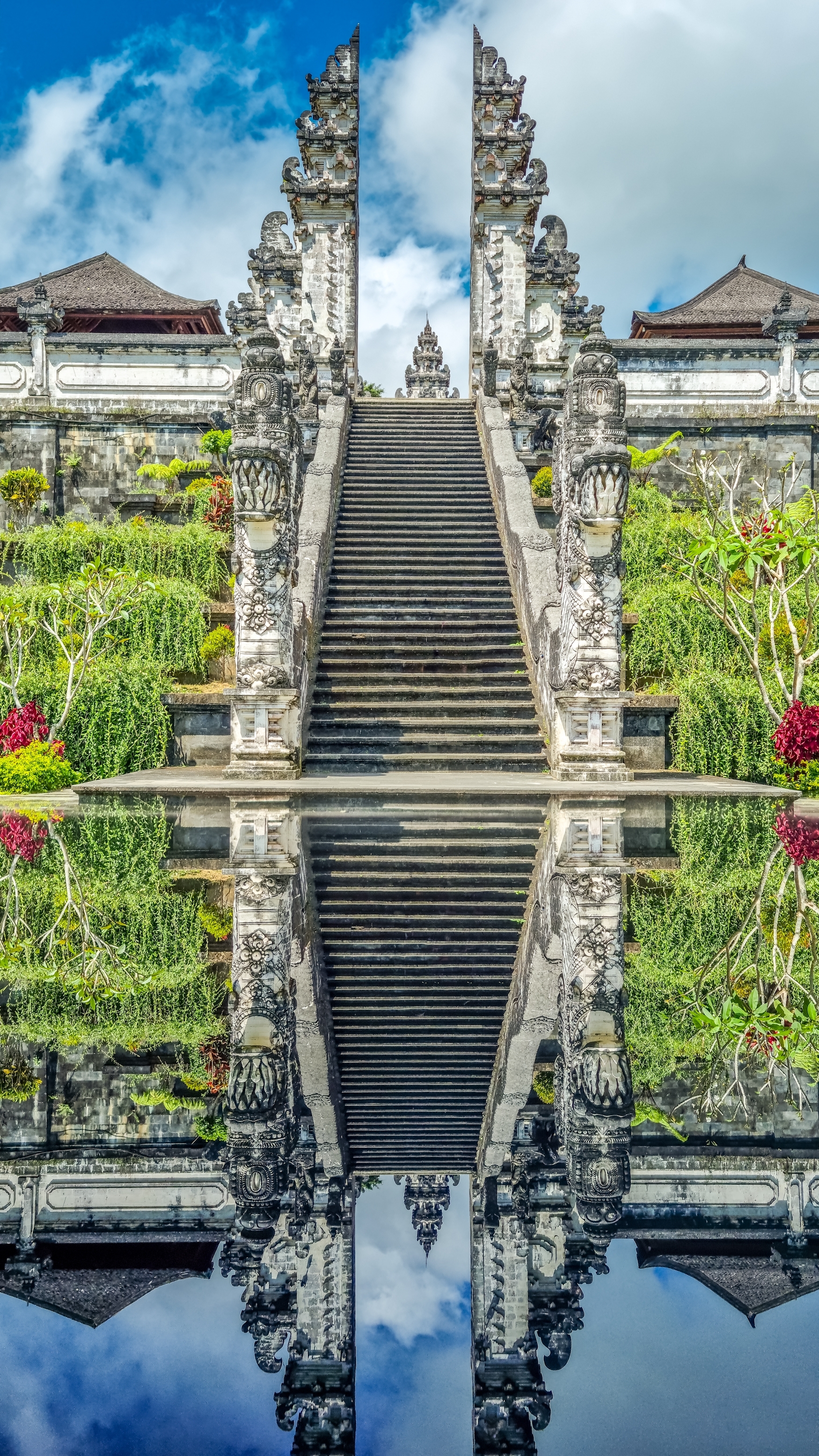 Steep stone steps reflected in a calm pool
