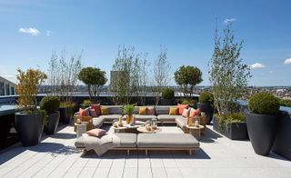The upper terrace designed by FLINT features seating and dining furniture selected by Bowler James Brindley