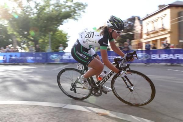 Alexis Rhodes (GreenEDGE) takes a corner in the evening sun.