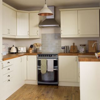 kitchen with extractor fans and wooden flooring