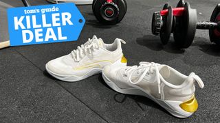 Puma Fuse 2.0 cross training shoes on gym floor next to dumbbells with killer deal badge top left