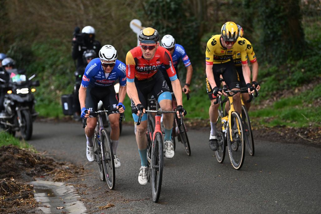 HARELBEKE BELGIUM MARCH 24 LR Sren Kragh Andersen of Denmark and Team AlpecinDeceuninck Matej Mohori of Slovenia and Team Bahrain Victorious and Nathan Van Hooydonck of Belgium and Team JumboVisma compete in the chase group during the 66th E3 Saxo Bank Classic Harelbeke 2023 a 2041km one day race from Harelbeke to Harelbeke on UCIWT March 24 2023 in Harelbeke Belgium Photo by Tim de WaeleGetty Images