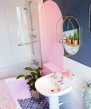 bathroom makeover using color blocking technique in pink and dark blue