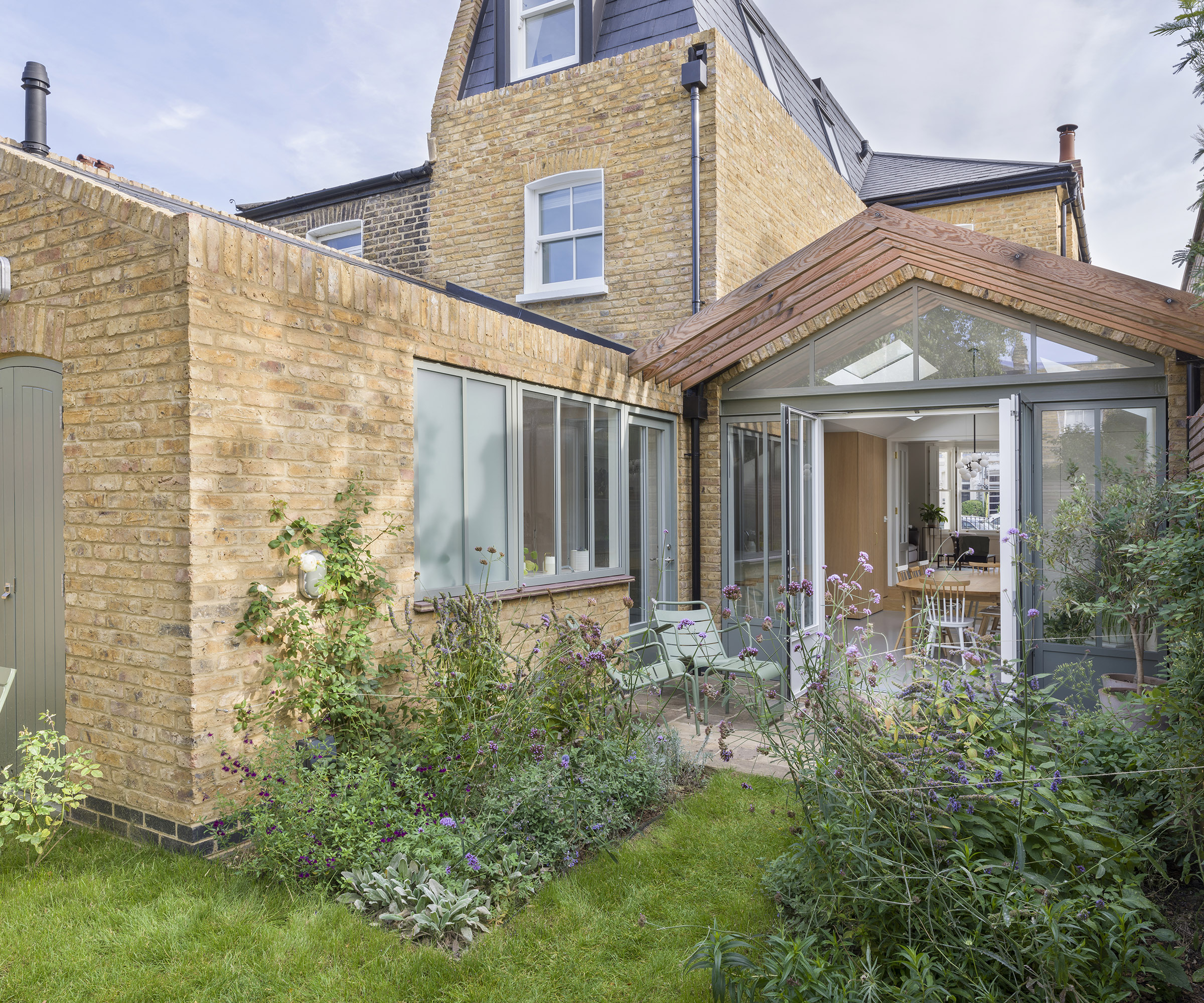 The rear exterior of an L shaped kitchen extension