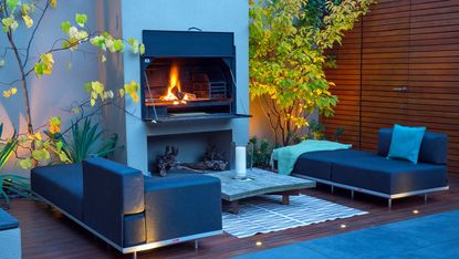 how to make a garden feel modern: outdoor fire