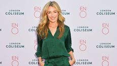 Cat Deeley in green shirt and trousers on the red carpet for Cinderella in 2025