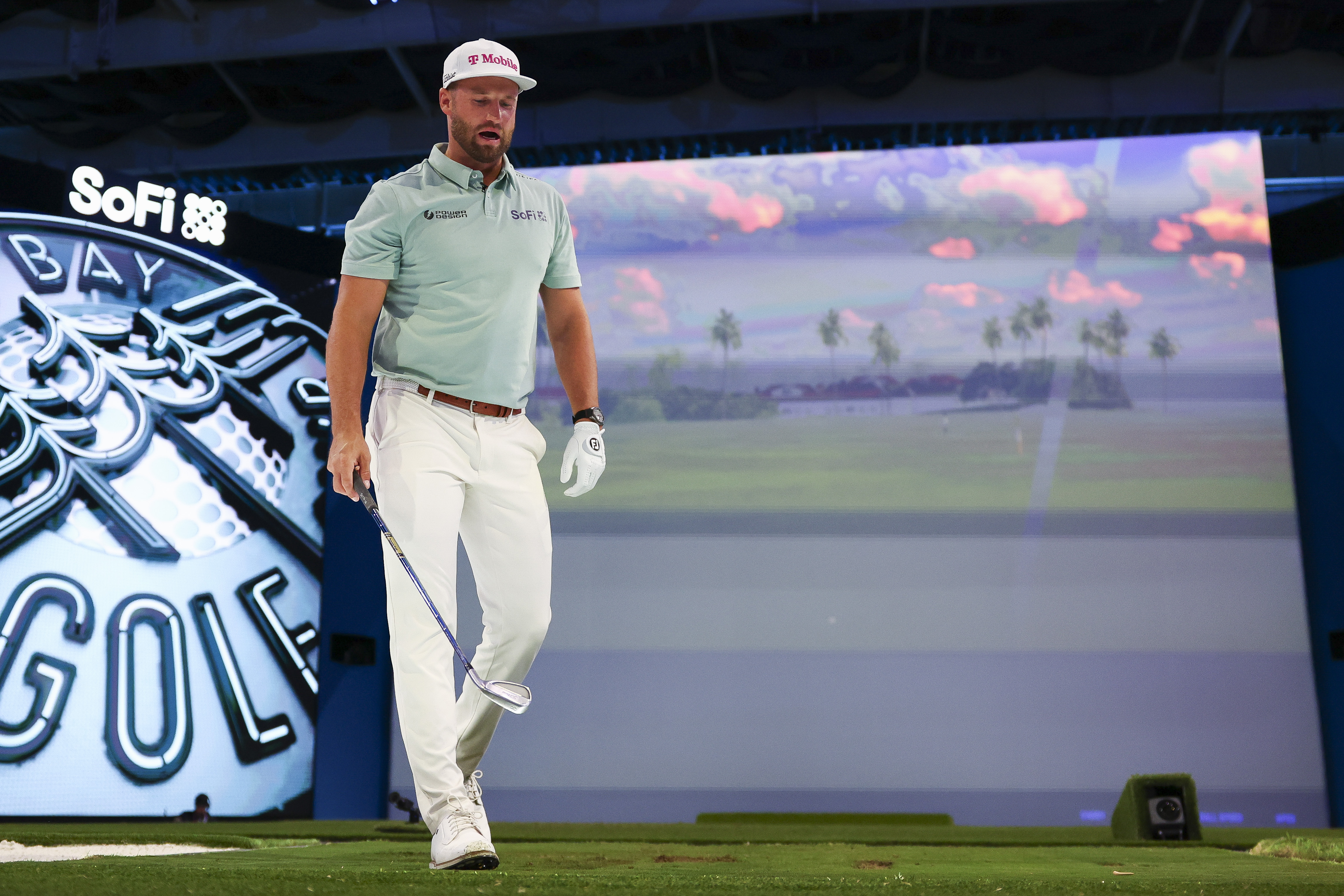 Wyndham Clark walks off the turf during TGL