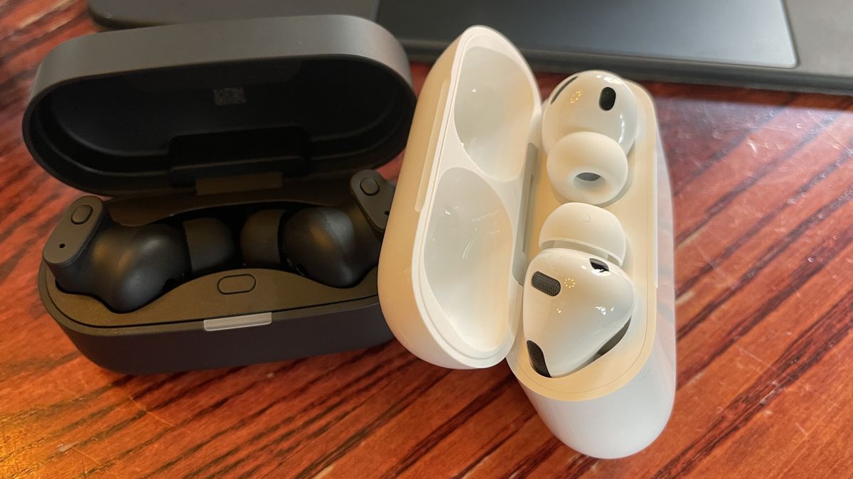 Status Audio Pro X GoldenSound, next to AirPods or held in a hand, with gold accents showing