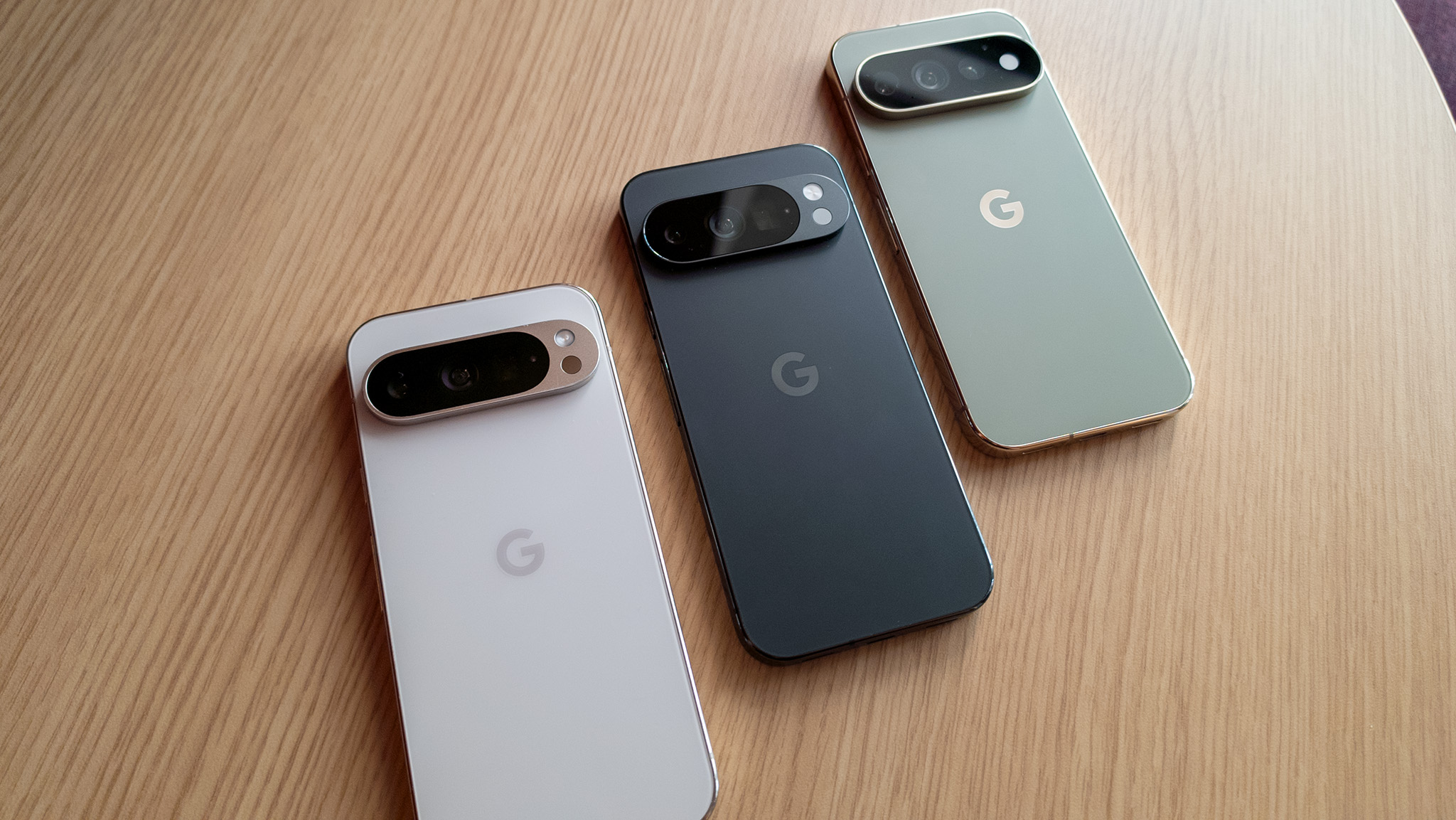 Comparing the Google Pixel 9 Pro (white) with the Pixel 10 Pro (grey) and the Pixel 11 Pro (green)