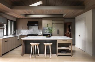 modern kitchen with wood floor, wood ceiling and wooden cabinets on the island