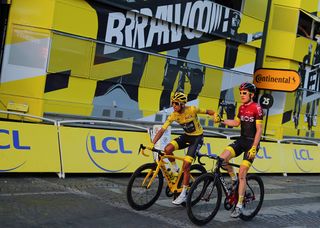 Egan Bernal (Team Ineos) celebrates with teammate Geraint Thomas at the end of the Tour de France