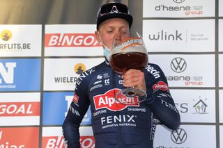 DOUR BELGIUM MARCH 02 Podium Tim Merlier of Belgium and Team AlpecinFenix Celebration during the 53rd Grand Prix Le Samyn 2021 Mens Elite a 2054km race from Quaregnon to Dour Trophy Beer Mask Covid Safety Measures GPSamyn on March 02 2021 in Dour Belgium Photo by Luc ClaessenGetty Images