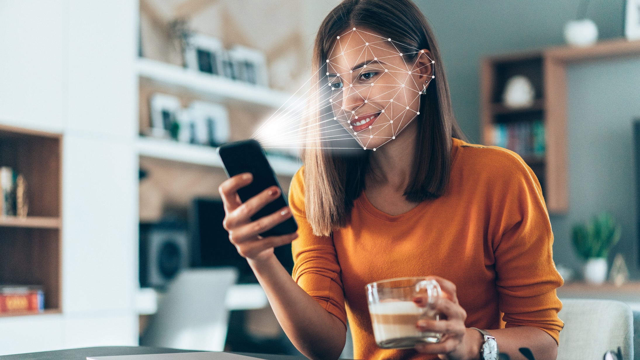 Woman having her face scanned by her phone