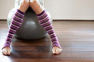 Woman sitting on an exercise ball