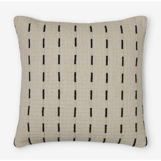 cream pillow with a raised black line pattern