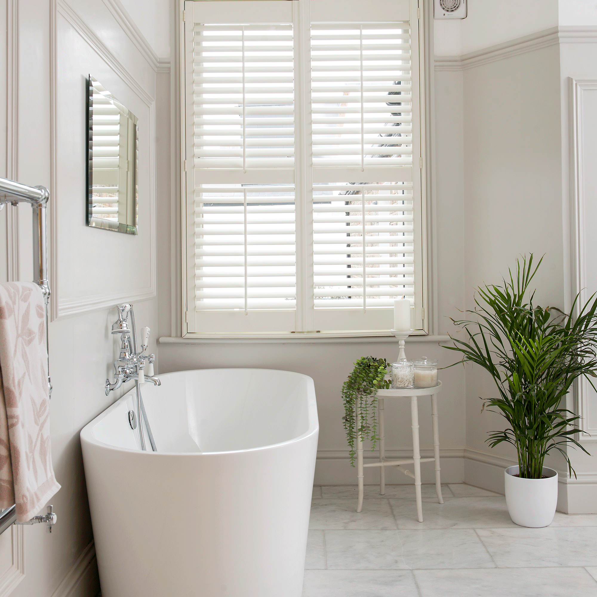 white bathroom with large tiles