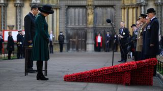 Camilla, Duchess of Cornwall, bows her head after laying a cross in the 93rd Field of Remembrance
