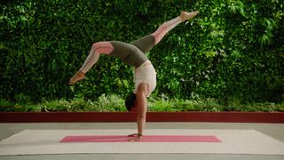 Person performing yoga in a garden