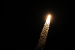 A SpaceX Falcon 9 rocket lights up the night sky over Florida as it launches a Dragon cargo ship toward the International Space Station from Cape Canaveral Air Force Station before dawn on June 29, 2018.