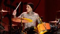 Travis Barker drumming on stage