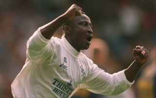 Tony Yeboah celebrates scoring his second goal against Wimbledon in September 1995