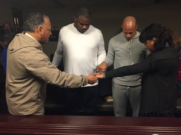 Officer Eric Crowder prays with Sgt. Chip Davis before Davis&amp;#039; kidney transplant.