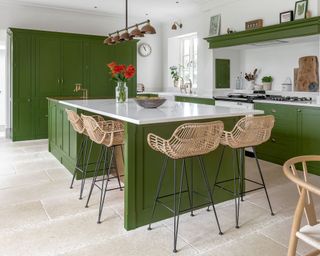 green kitchen kitchen island with rattan barstools