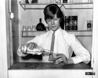 David Bowie pouring a cocktail in 1966