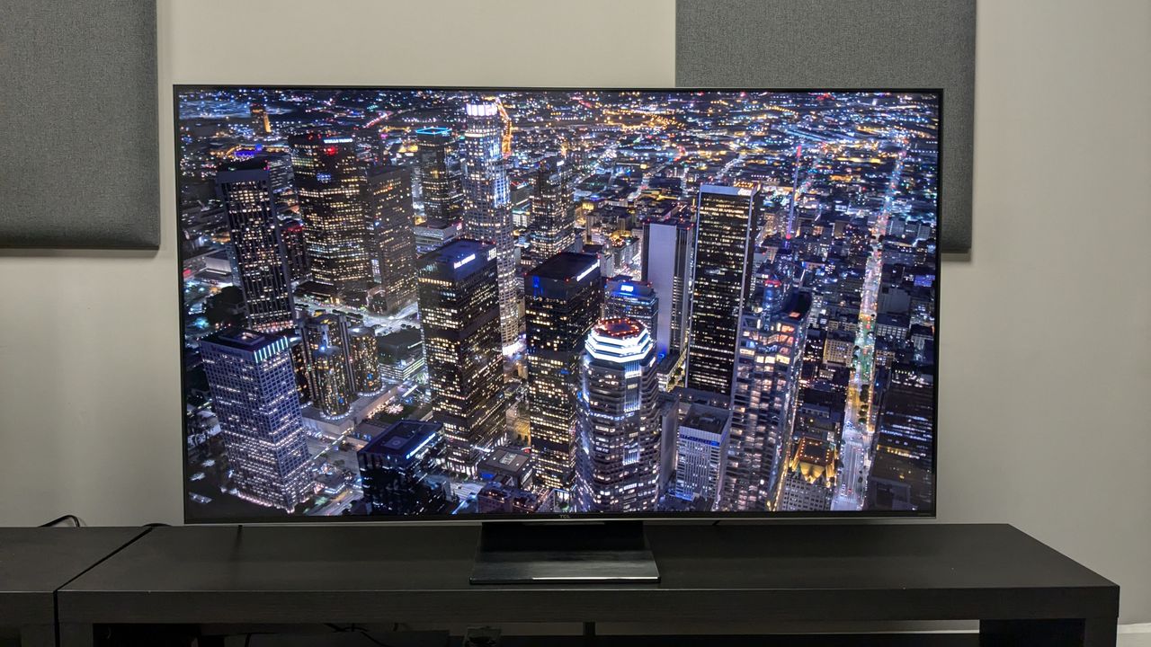 TCL C805 with aerial shot of city at night on screen