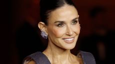 Demi Moore is pictured with a slicked-back bun and shimmery eyeliner at the Academy Museum of Motion Pictures 4th Annual Gala in Partnership with Rolex at Academy Museum of Motion Pictures on October 19, 2024 in Los Angeles, California. 