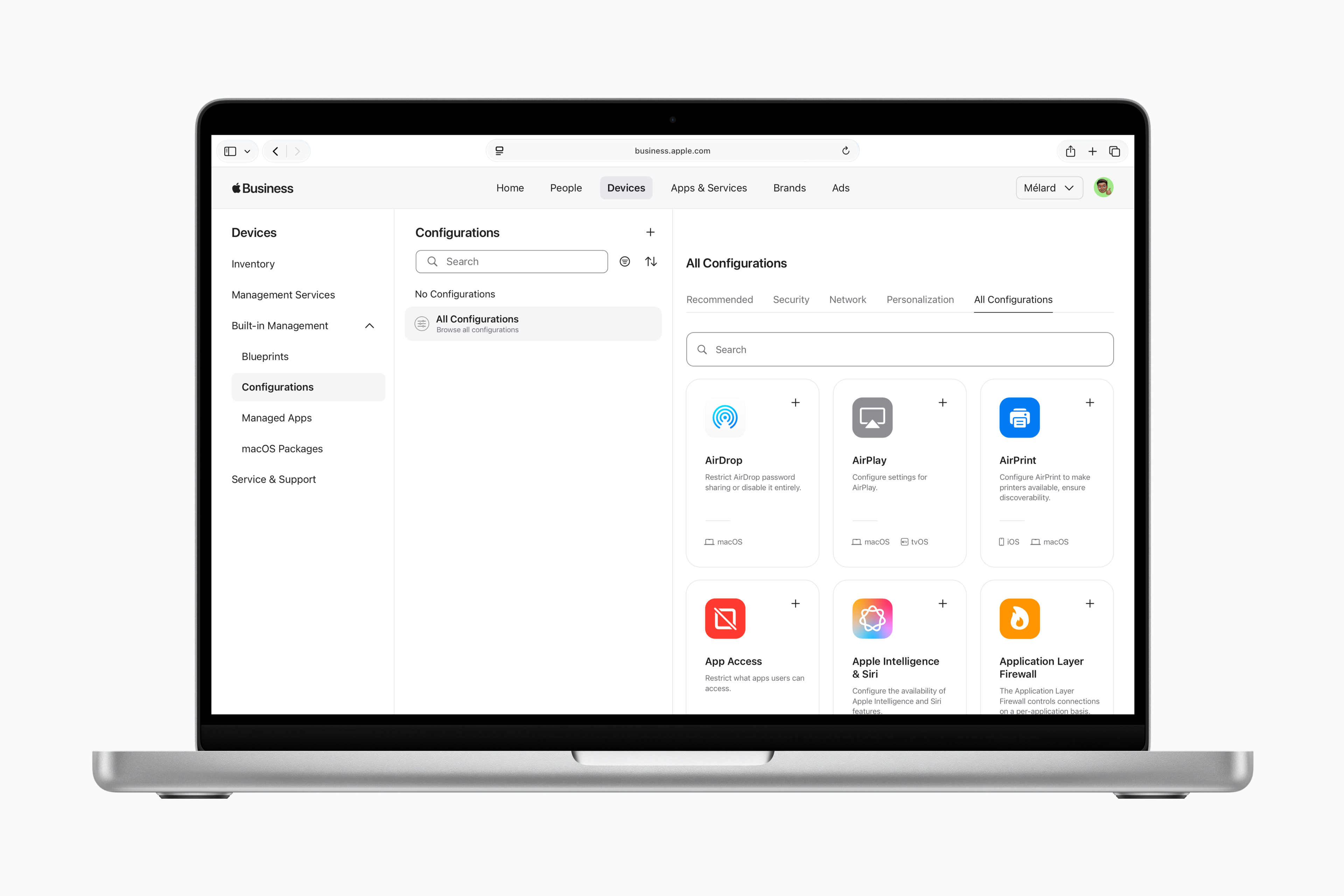 Apple Business suite application features pictured on a MacBook screen.