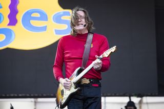 Murray Cook on stage as the Red Wiggle