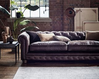 Furniture Village Alexander and James Brixton 4 Seater brown Leather Sofa, £2295, Toldeo Lamp Table, £159, Sona Tripod Lamp, £99, Varrick Rug, £499
