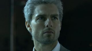 Tom Cruise stares off into the night in Collateral.